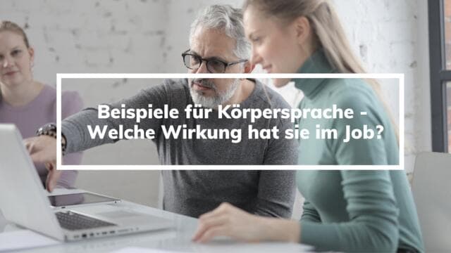 A woman and a man looking at a laptop