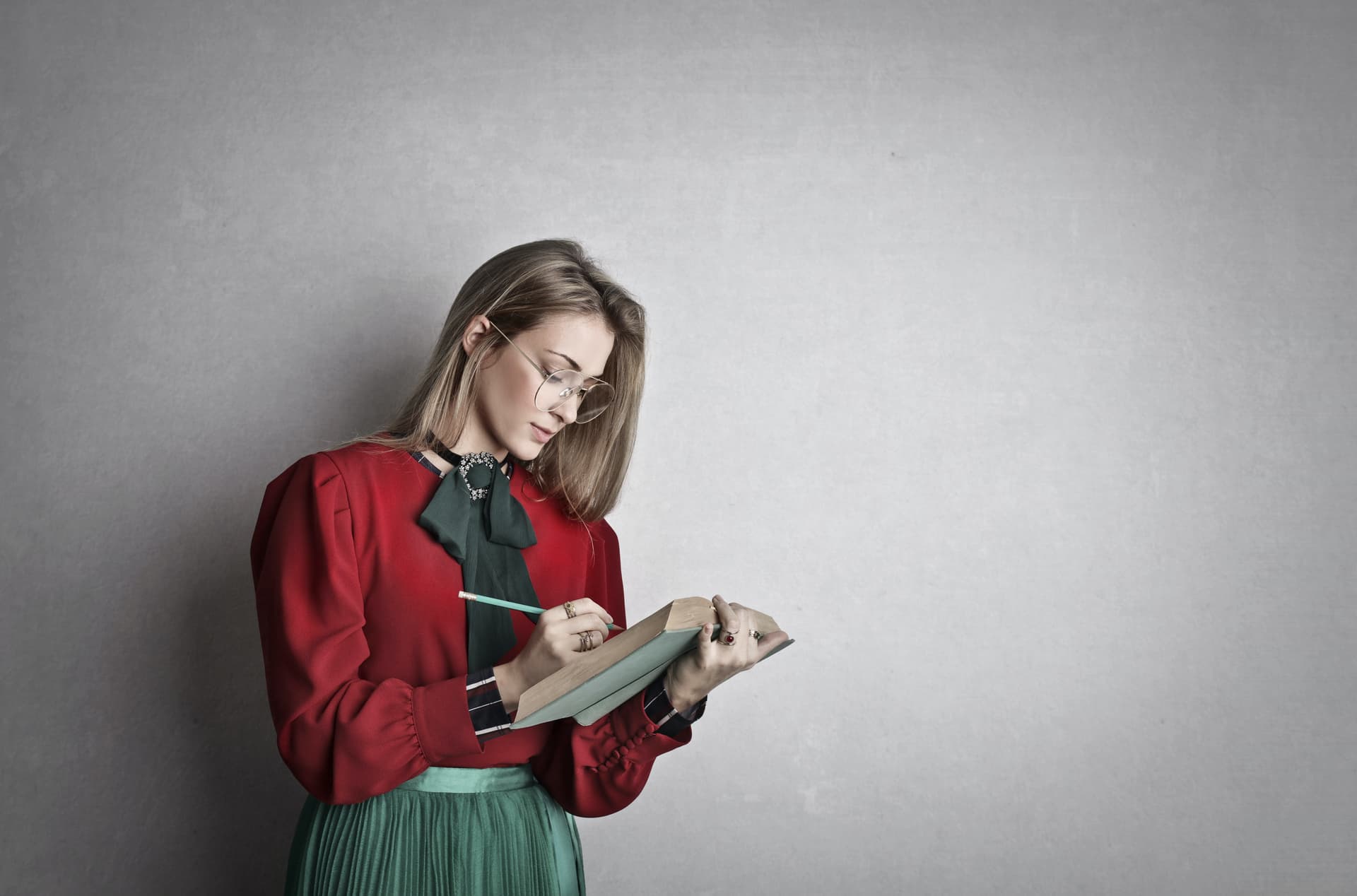A woman writing in a notebook
